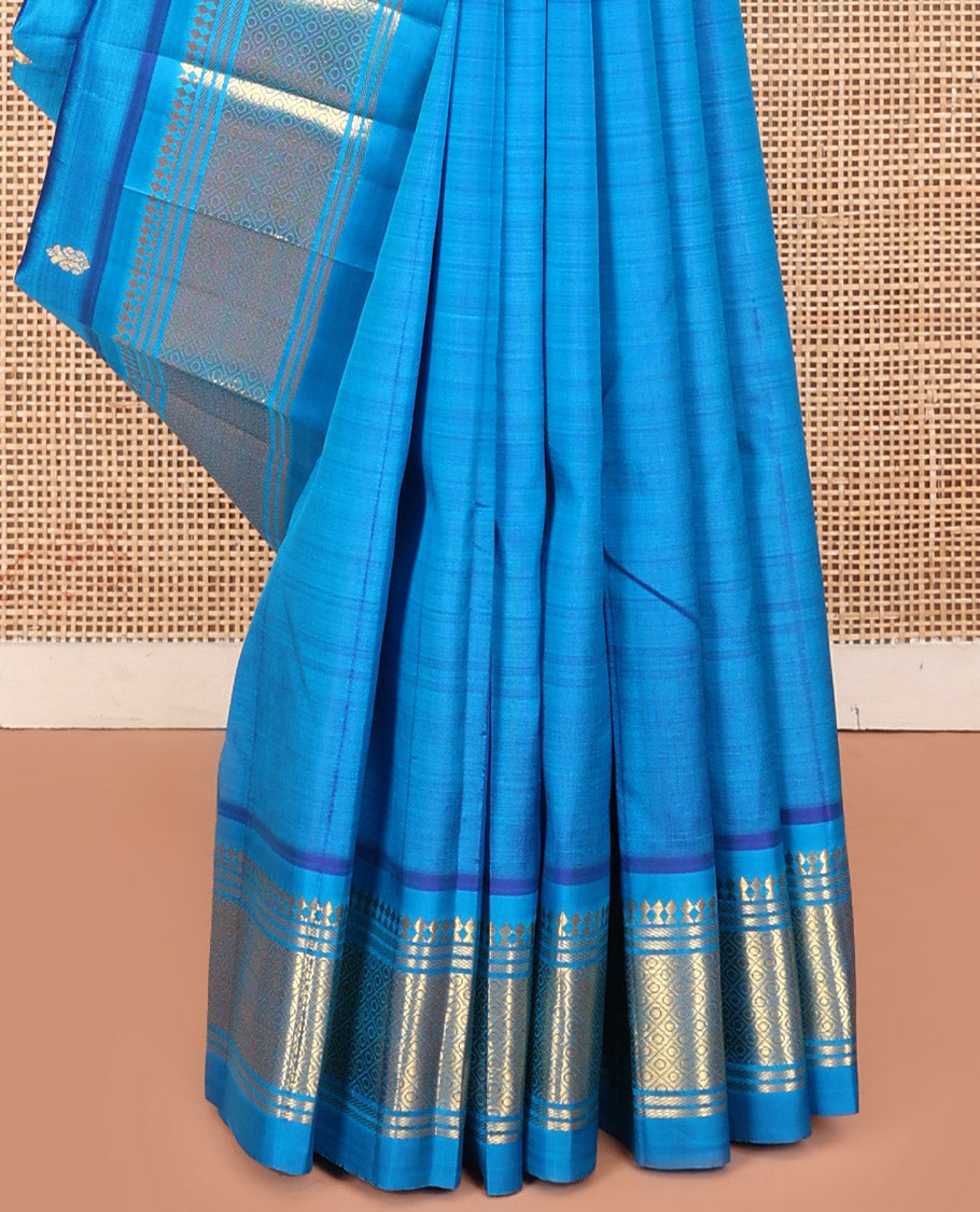 Blue Kanchipuram Silk Saree, Detailed with Zari Buttas, a One-Sided Border Featuring Panner Sombu, Banaras, and Jaal Design, Pallu of Kodi Visiry, and No Blouse