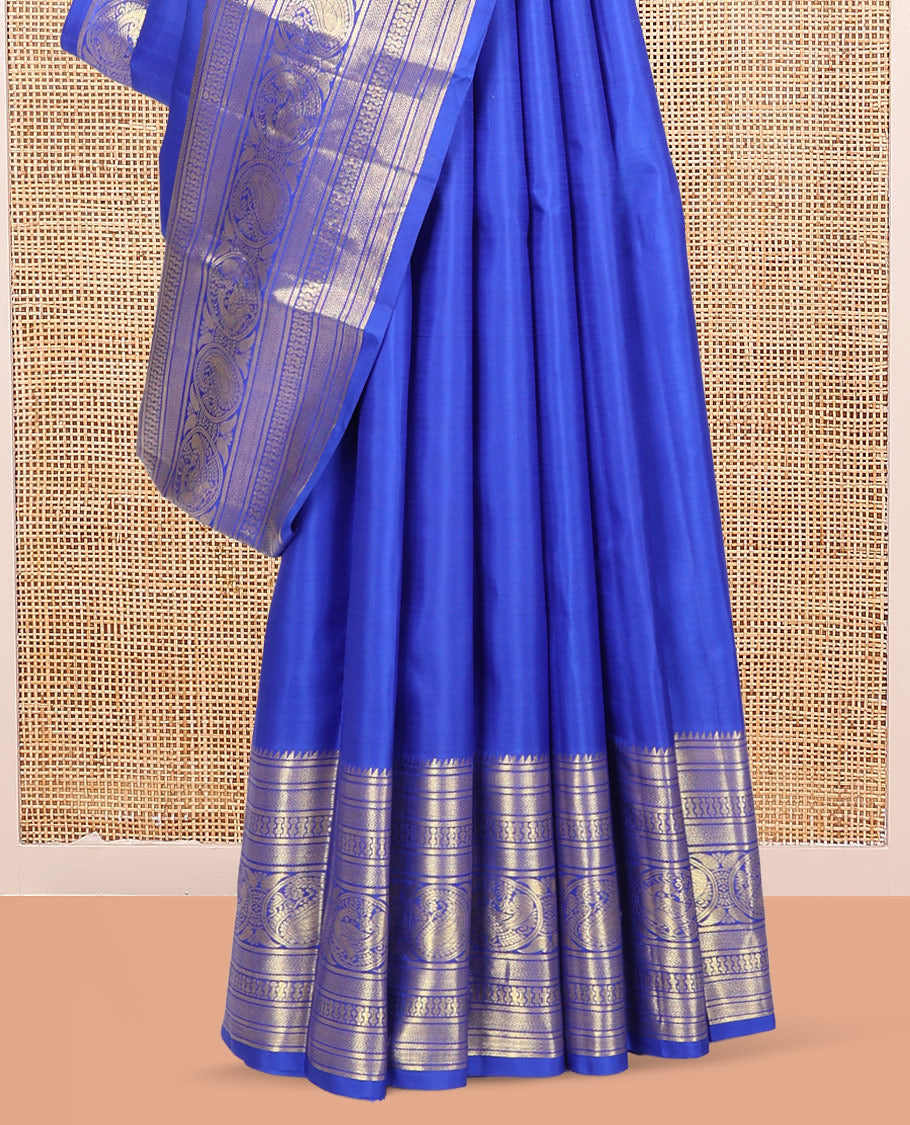 Blue Kanchipuram Silk Saree, Graced with Zari Buttas, Highlighted by Zari Border of Rekku, Vanki, Round Manga, and Round Mayil, Zari Design Pallu, and Matching Blouse