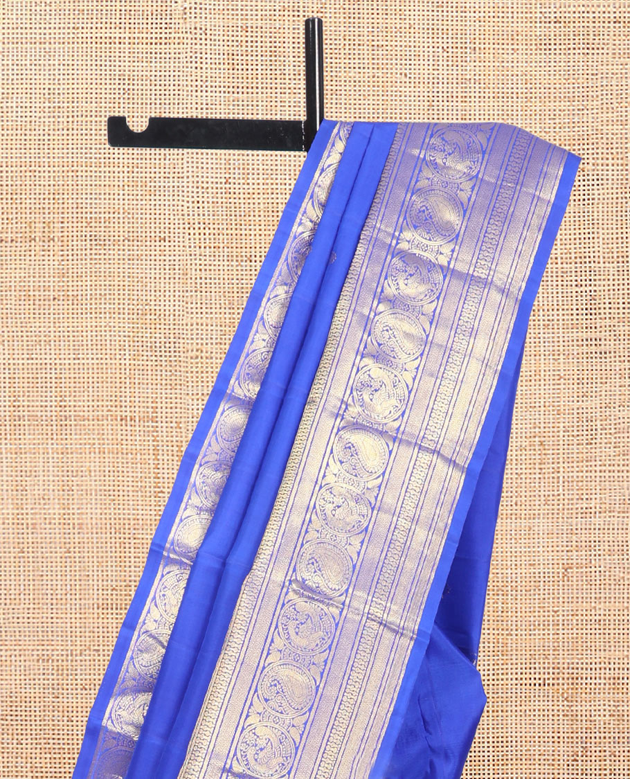 Blue Kanchipuram Silk Saree, Graced with Zari Buttas, Highlighted by Zari Border of Rekku, Vanki, Round Manga, and Round Mayil, Zari Design Pallu, and Matching Blouse
