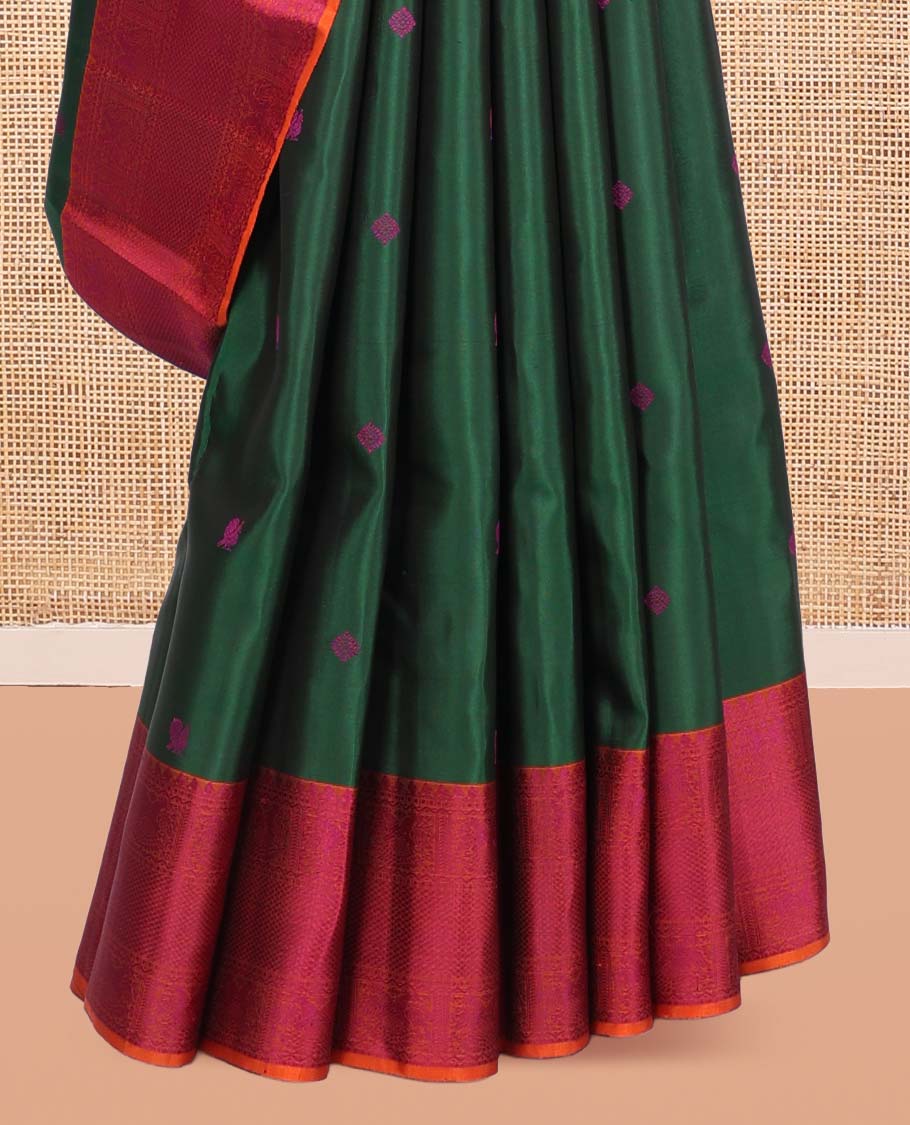 Green Kanchipuram Silk Saree, Beautified with Thread Buttas, a Contrast Border of Thilakam Mokku, Iruthalai Pakshi, and Kuyil Kann, Jaal Pallu, and a Contrast Blouse