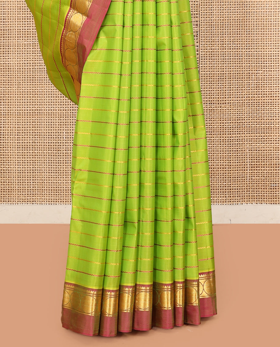 Green Veldhari Striped Kanchipuram Silk Saree, Complemented by a Contrast Kal Eragina Border of Thilakam Mokku, and Rudraskham Design, Pallu of Zari Stripes, and a Contrast Blouse