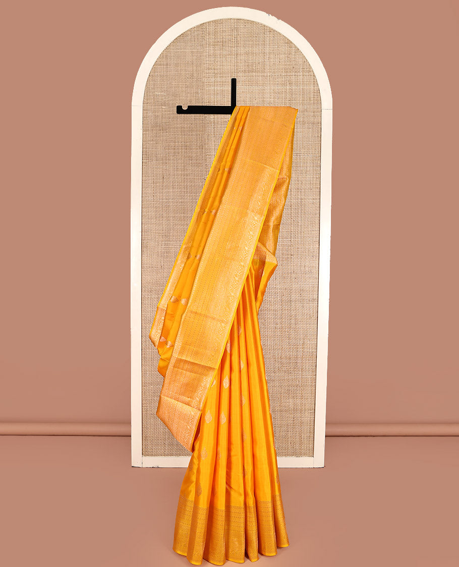 Yellow Kanchipuram Silk Saree, Subtly Sparkled with Zari Buttas All Over Its Body, Highlighted by a Zari Traditional Design Border, Grand Pallu, and Paired with a Matching Blouse