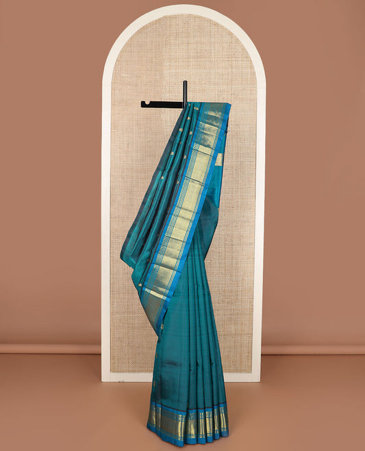 Blue zari buttas Kanchipuram silk saree, contrast border of paneer sombu, banaras & mayil kann & zari design pallu