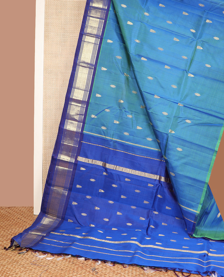Blue zari buttas Kanchipuram silk saree, contrast one-sided border of paneer sombu, banaras, muthu and jaal design, and zari design pallu