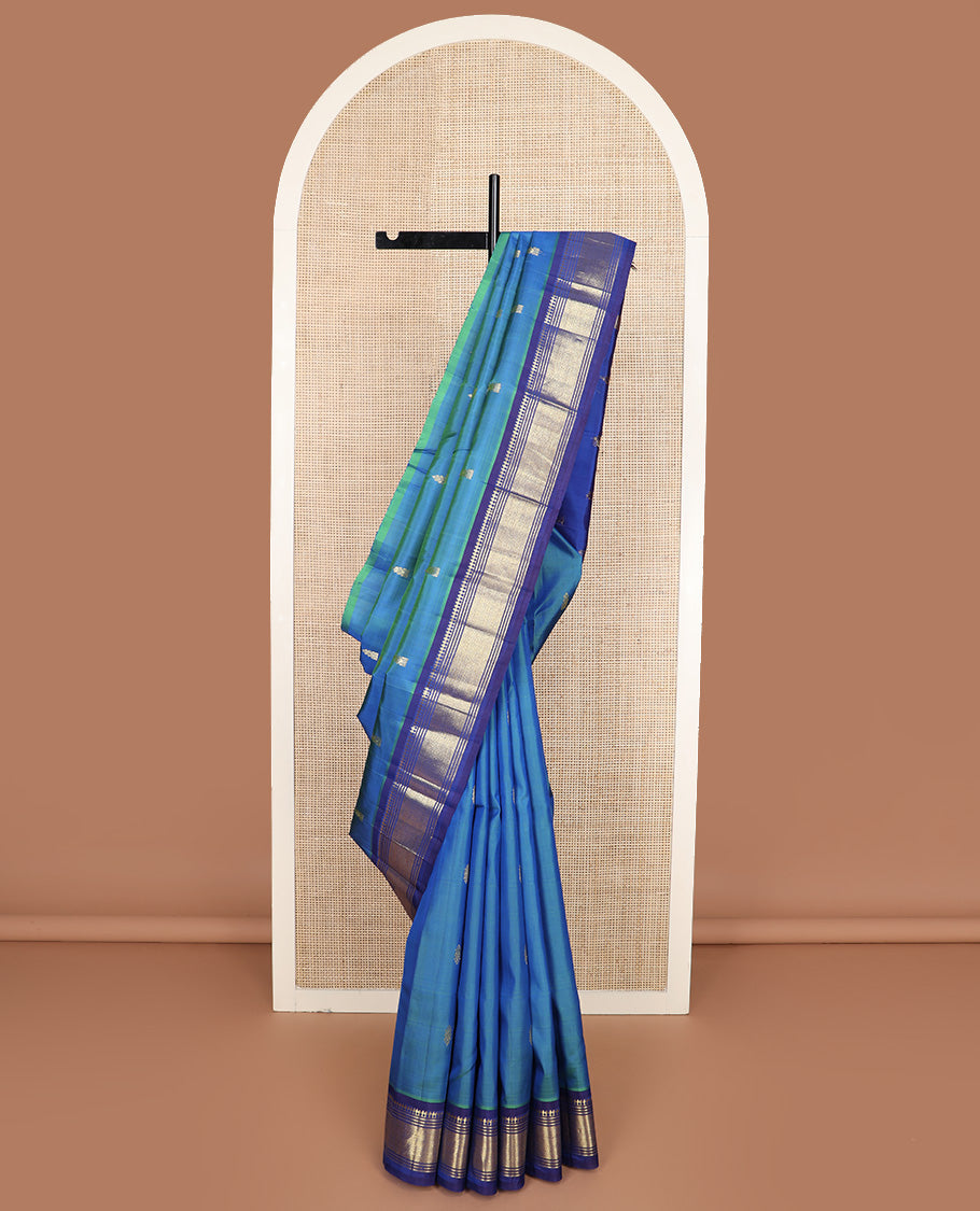 Blue zari buttas Kanchipuram silk saree, contrast one-sided border of paneer sombu, banaras, muthu and jaal design, and zari design pallu