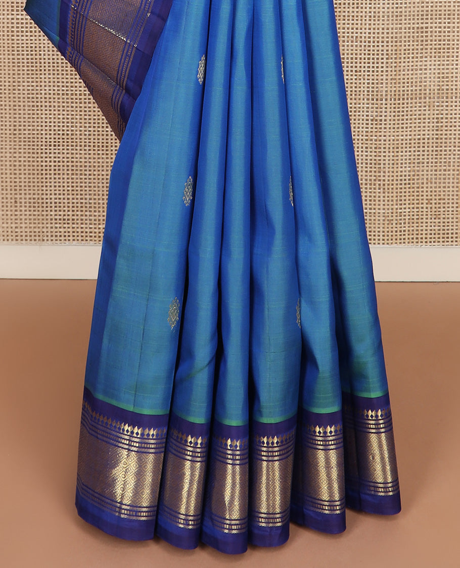 Blue zari buttas Kanchipuram silk saree, contrast one-sided border of paneer sombu, banaras, muthu and jaal design, and zari design pallu
