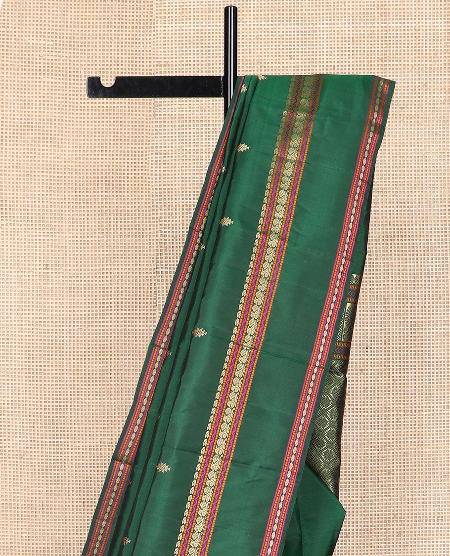 Green buttas Kanchipuram silk saree, rettai pettu border of manga, neli, mayil, and rudraksham designs, and jaal pallu
