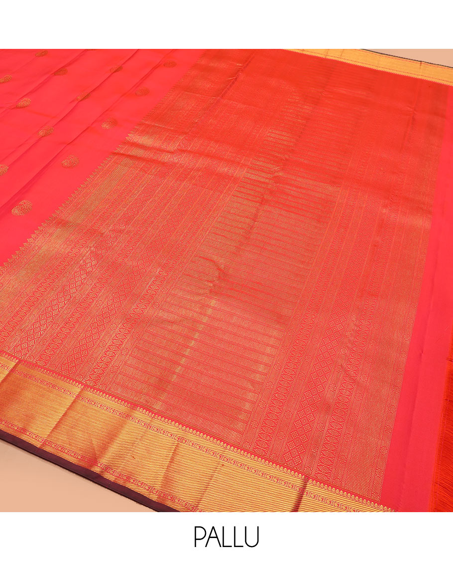 Red manga buttas Kanchipuram silk saree, zari border of thilakam mokku, zari stripes, and manga designs, and geometric patterned pallu