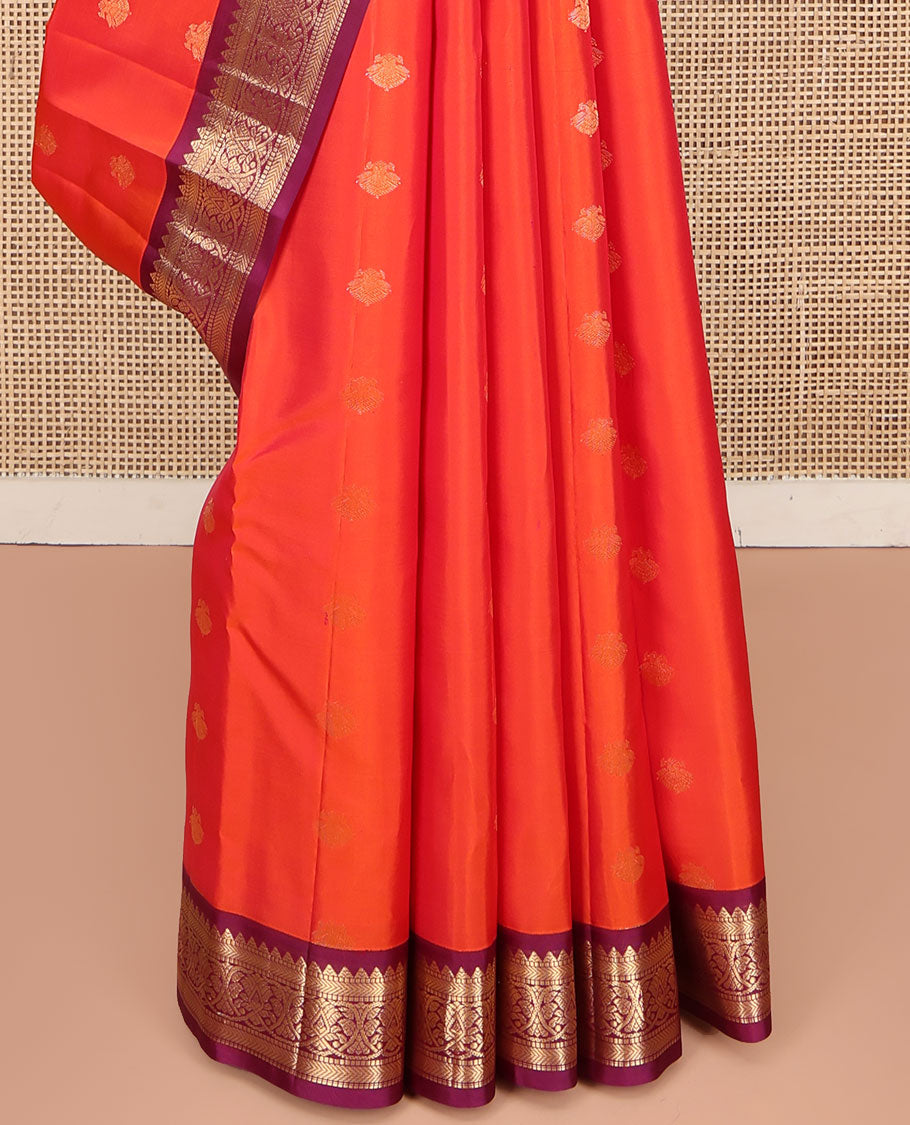 Orange Kanchipuram Silk Saree, Decked Up with Iruthalai Pakshi Buttas on Its Body, Complemented by a Contrast Border of Rekku, Muthu, and Kathir Designs, Grand Jaal Pallu, and Paired with a Contrast Blouse