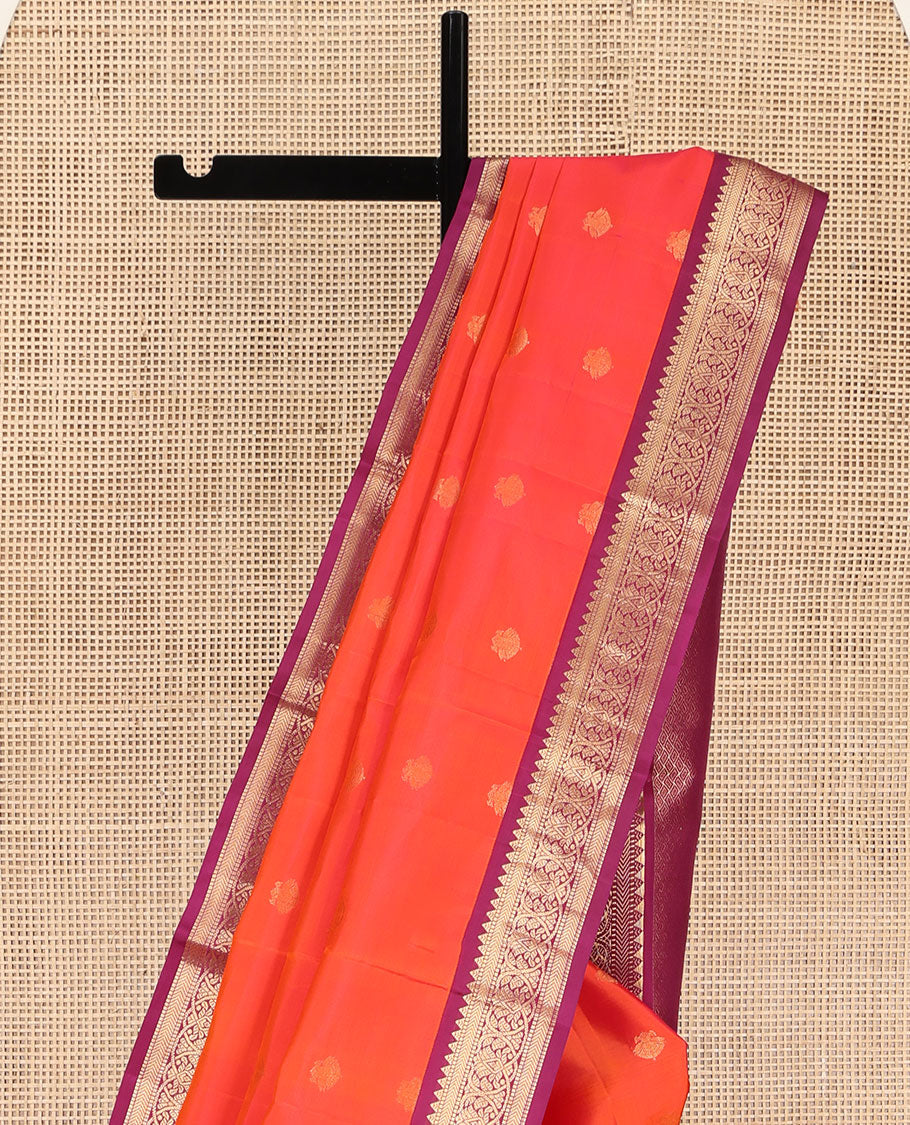 Orange Kanchipuram Silk Saree, Decked Up with Iruthalai Pakshi Buttas on Its Body, Complemented by a Contrast Border of Rekku, Muthu, and Kathir Designs, Grand Jaal Pallu, and Paired with a Contrast Blouse