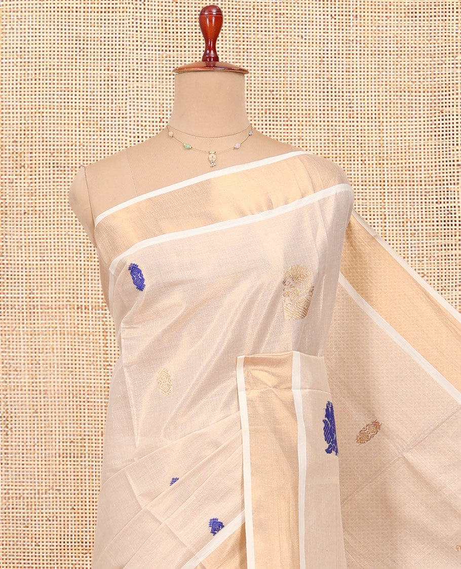 Cream Kerala Cotton Saree, Elevated with Thread and Zari Buttas All Over Its Body, a Zari Bavanji Border, Pallu of Elephant Designs, and Paired with a Matching Blouse