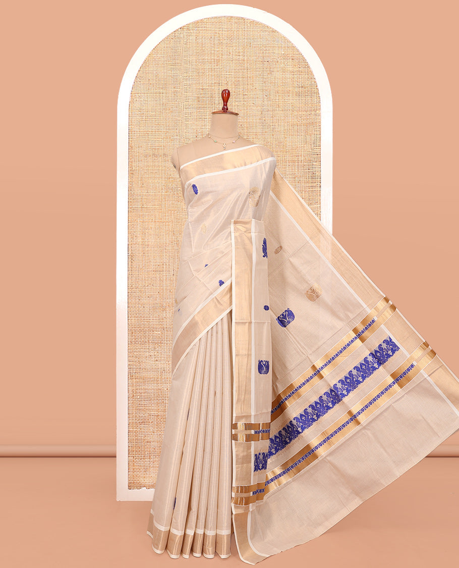 Cream Kerala Cotton Saree, Elevated with Thread and Zari Buttas All Over Its Body, a Zari Bavanji Border, Pallu of Elephant Designs, and Paired with a Matching Blouse