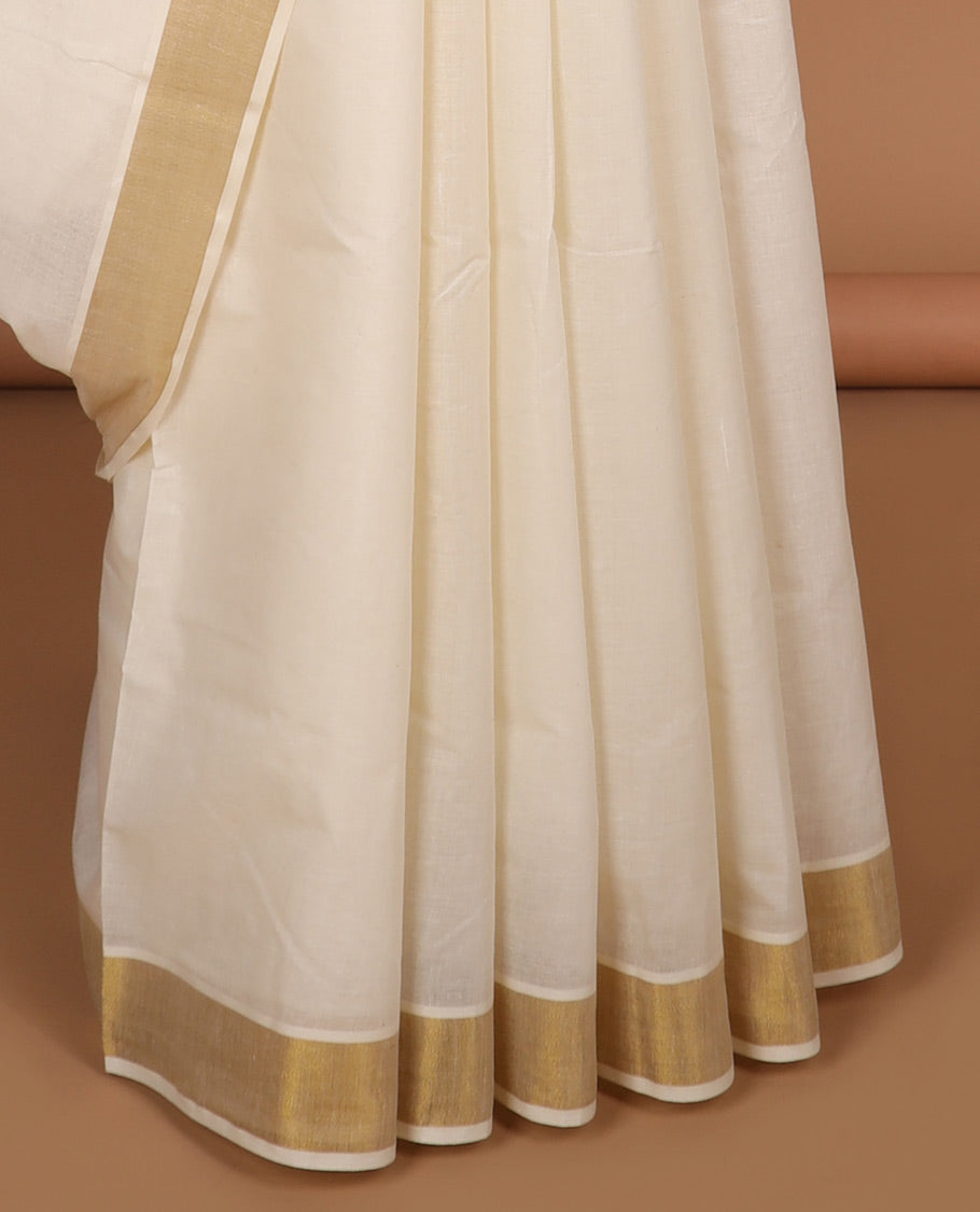 Cream plain design kerala saree, zari border & pallu of zari designs