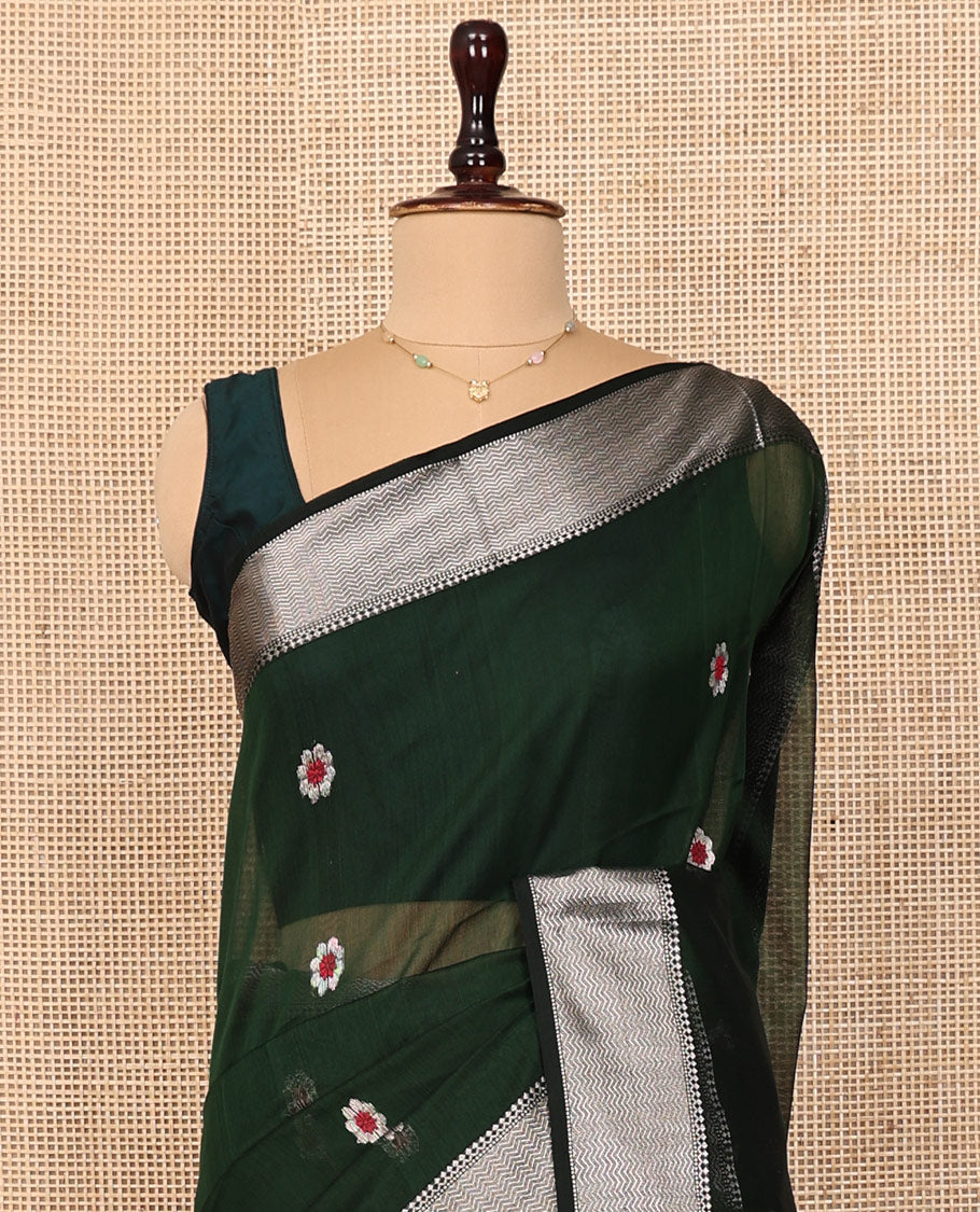 Green Maheshwari Cotton Saree, Bedecked with Meena Buttas All Over Its Body, Highlighted by a Traditional Zari Woven Border, Pallu Steeped with Gleaming Zari Stripes and Buttas, and Paired with a Matching Blouse