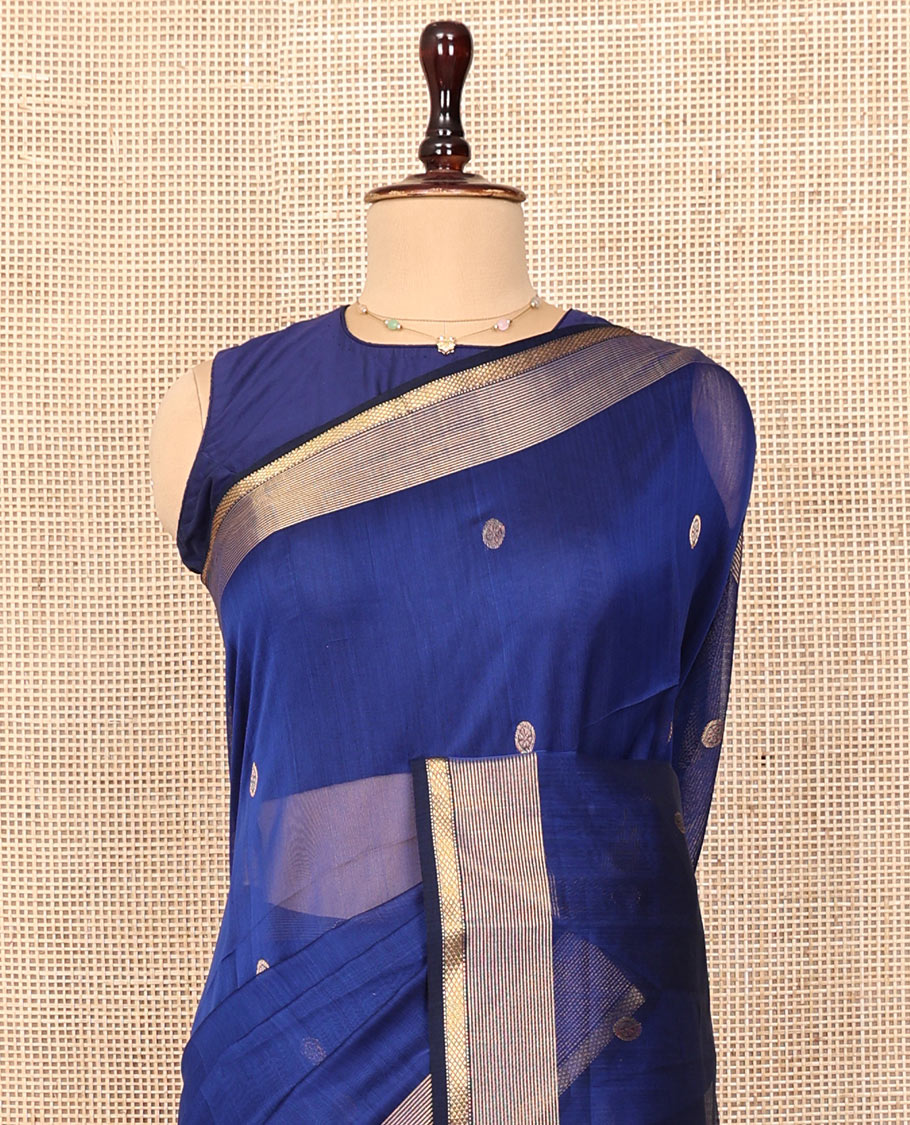Blue Plain Maheshwari Cotton Saree, Mesmerized with Buttas All Over Its Body, Highlighted by a Zari Border of Traditional Designs, Gleaming Pallu Steeped with Zari Stripes, and Paired with a Matching Blouse