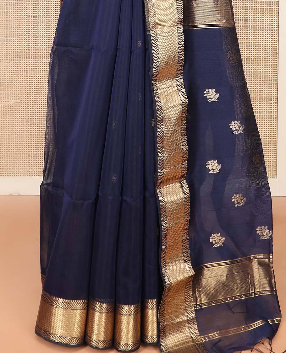 Navy Blue Maheshwari Cotton Saree Prettified with Floral Buttas, Highlighted with a Traditional Zari Design Border, Pallu Adorned with Zari Stripes and Floral Buttas, and Paired with a Matching Blouse