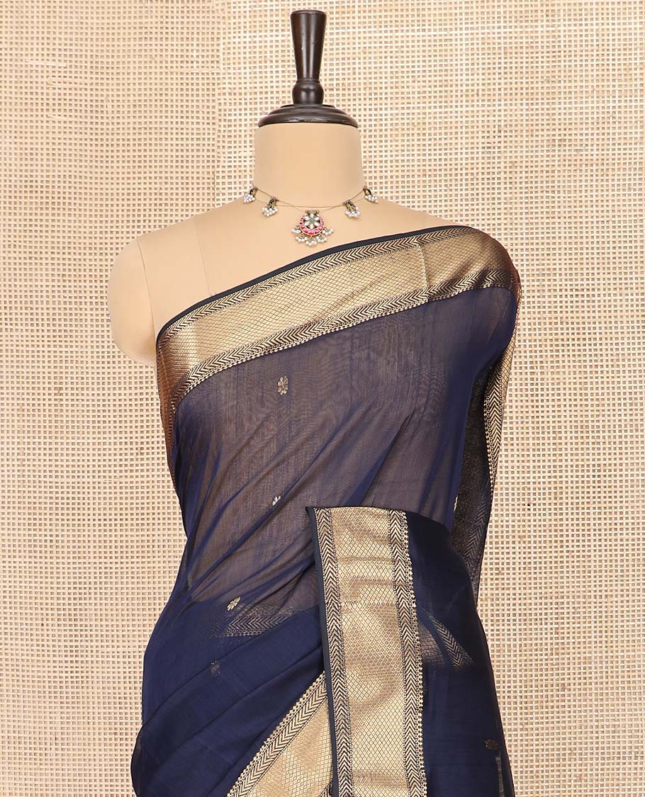 Navy Blue Maheshwari Cotton Saree Prettified with Floral Buttas, Highlighted with a Traditional Zari Design Border, Pallu Adorned with Zari Stripes and Floral Buttas, and Paired with a Matching Blouse