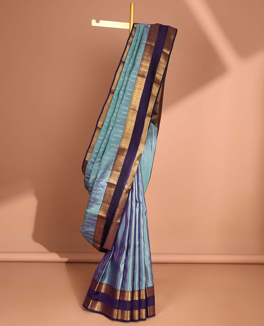Light blue striped design vasundhara elite silk saree with contrast rettai pettu zari design border & intricate zari design pallu