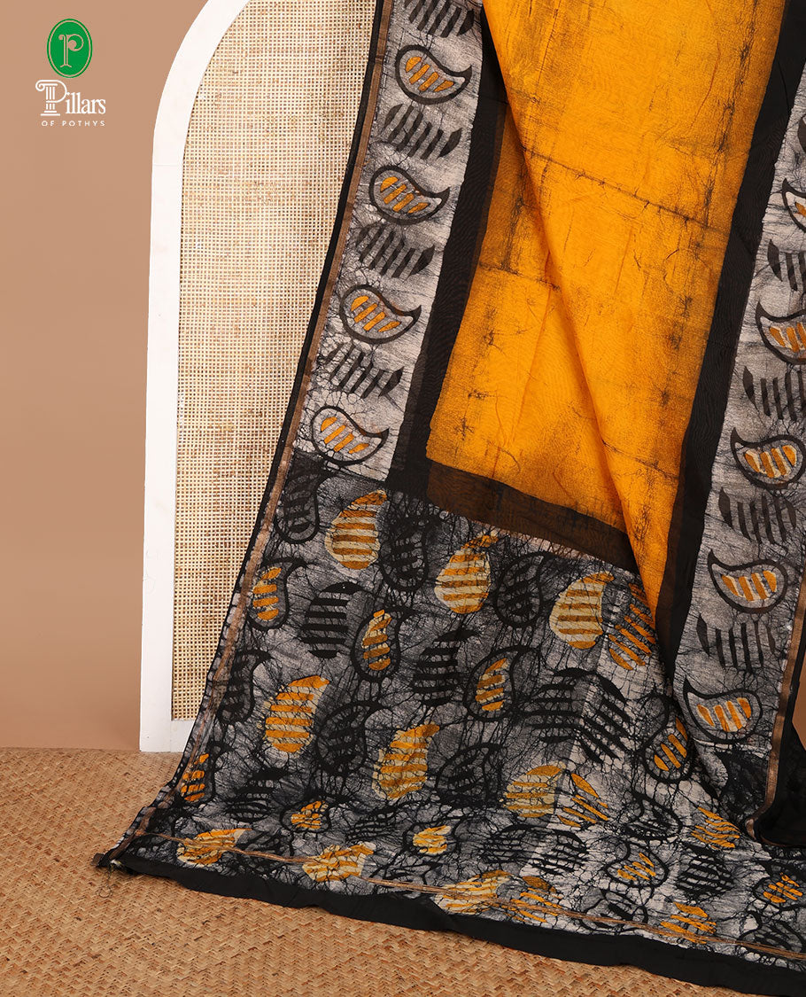 Mustard hand block batik printed chanderi cotton saree with black wax, checked border & black wax printed pallu along with plain blouse