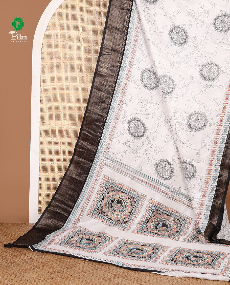 Black with white kalamkari printed dola silk saree, contrast jacquard border & madhubani printed pallu along with floral printed blouse