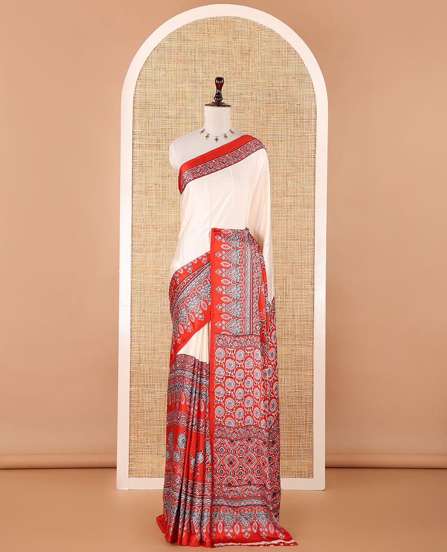 Cream half-plain & half-printed gajji silk saree, contrast red border & pallu of Ajrakh-print with printed blouse