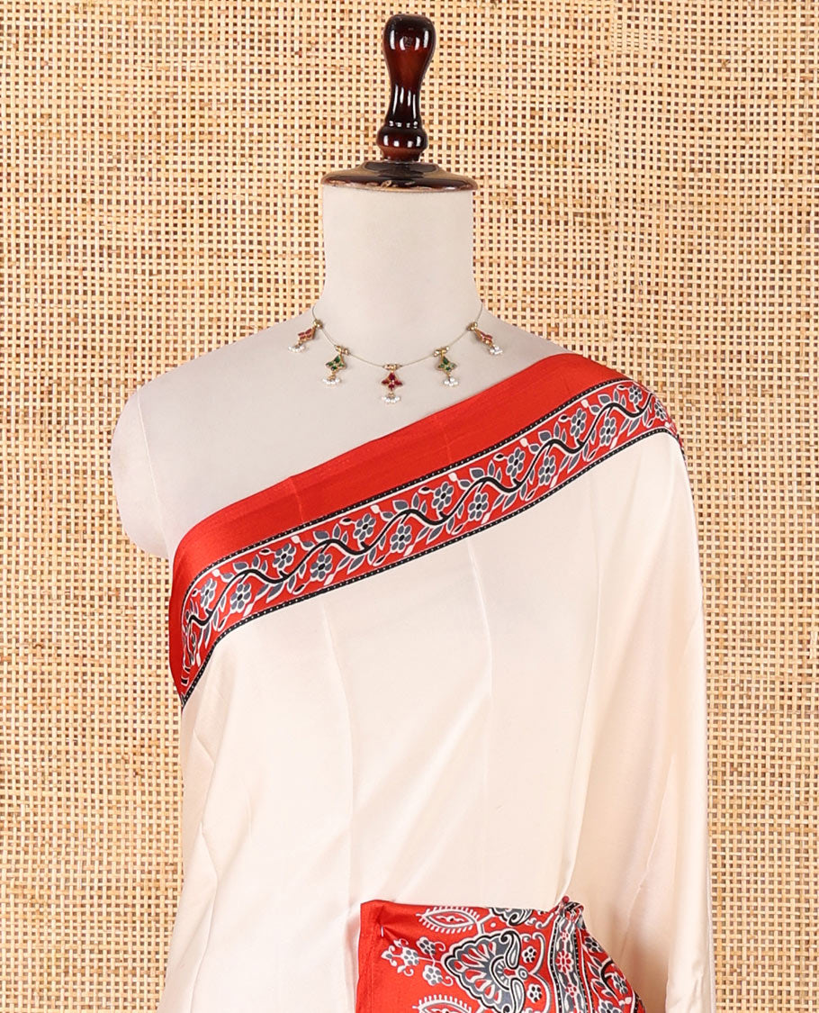 Cream half-plain & half-printed gajji silk saree, contrast red border & pallu of Ajrakh-print with printed blouse