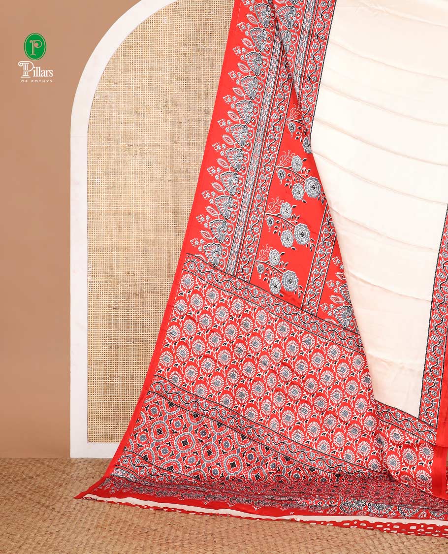 Cream half-plain & half-printed gajji silk saree, contrast red border & pallu of Ajrakh-print with printed blouse