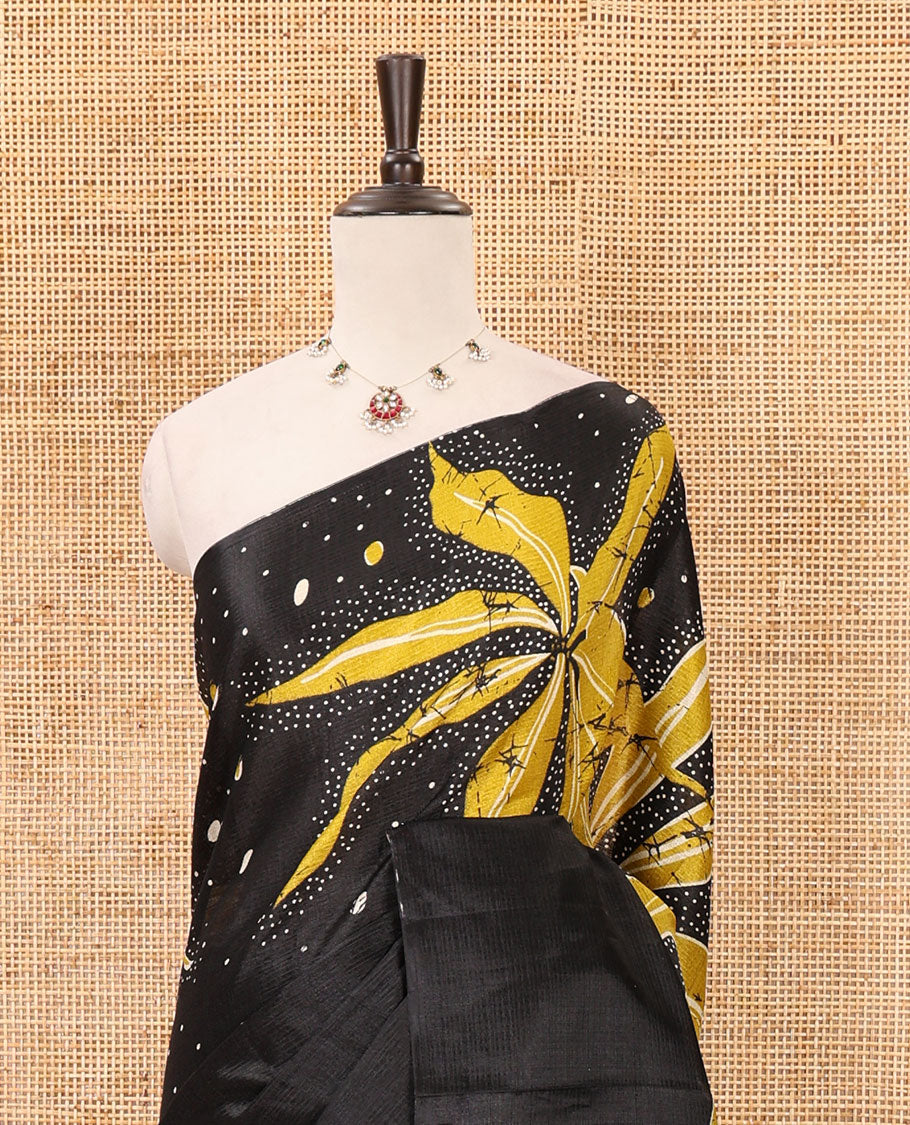 Black-base plain body khadi cotton saree with batik-style yellow-color radiant sunburst design on its border & pallu, plain black blouse