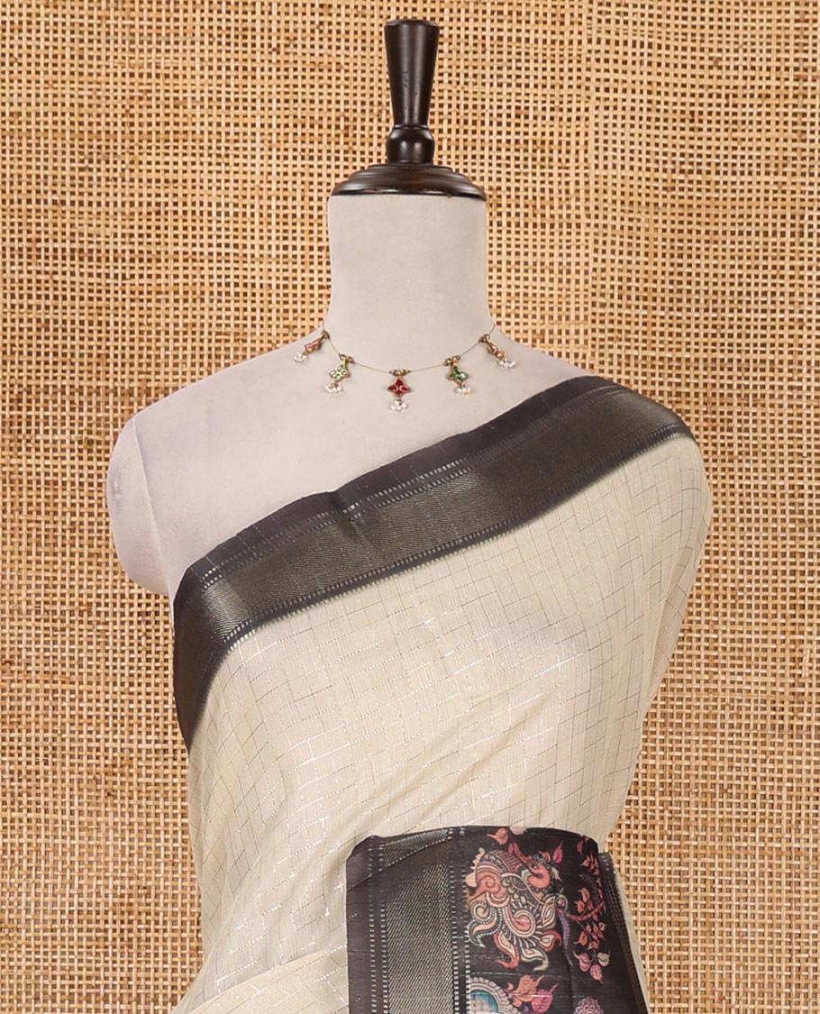 Cream zari checked tissue saree, contrast elephant & peacock printed zari border & pallu of zari stripes & contrast zari design blouse