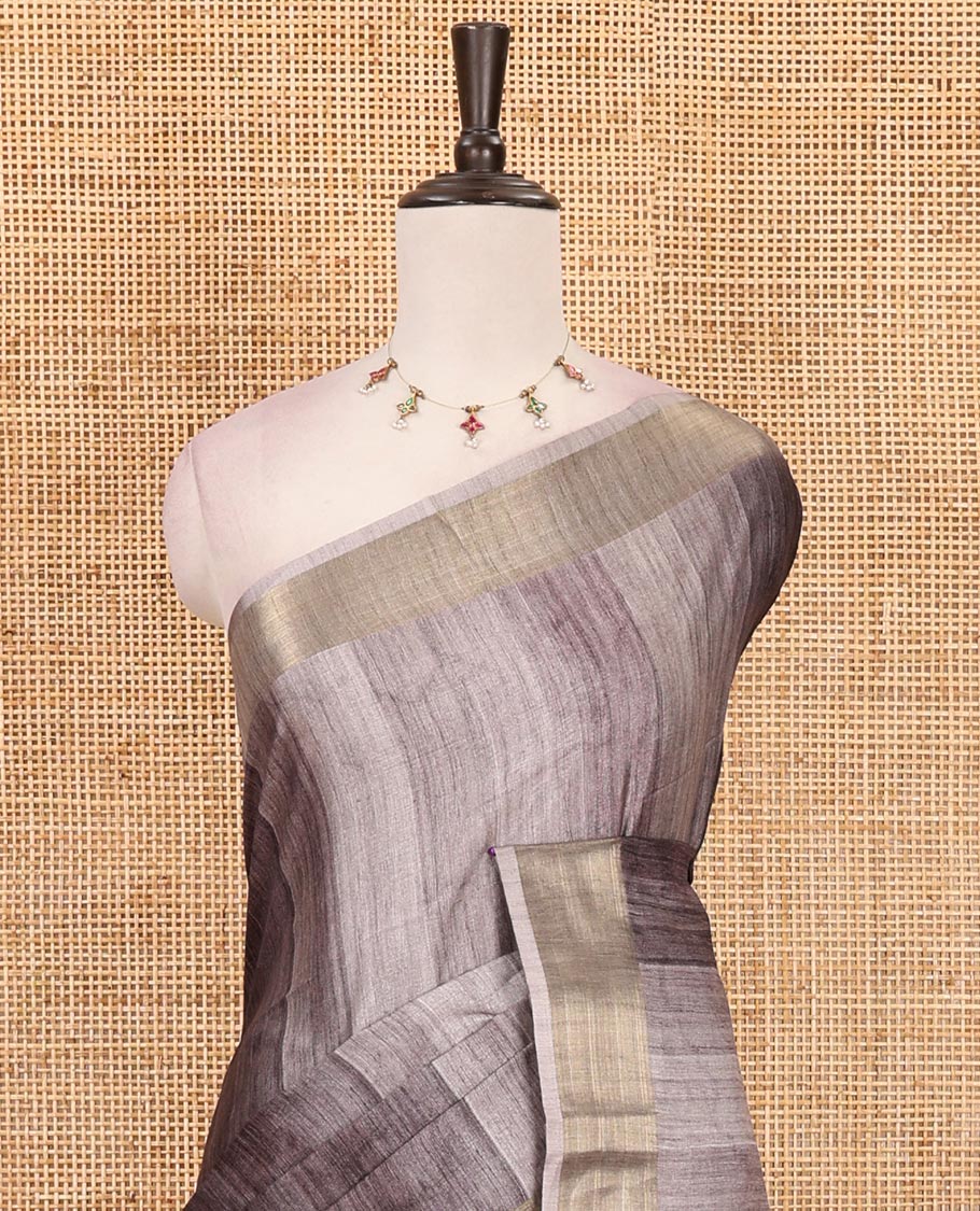 Black vertical stripes printed hand-brush dyed Katan silk saree, gold zari bavanji border, Madhubani-style human figurines printed pallu, and floral printed blouse