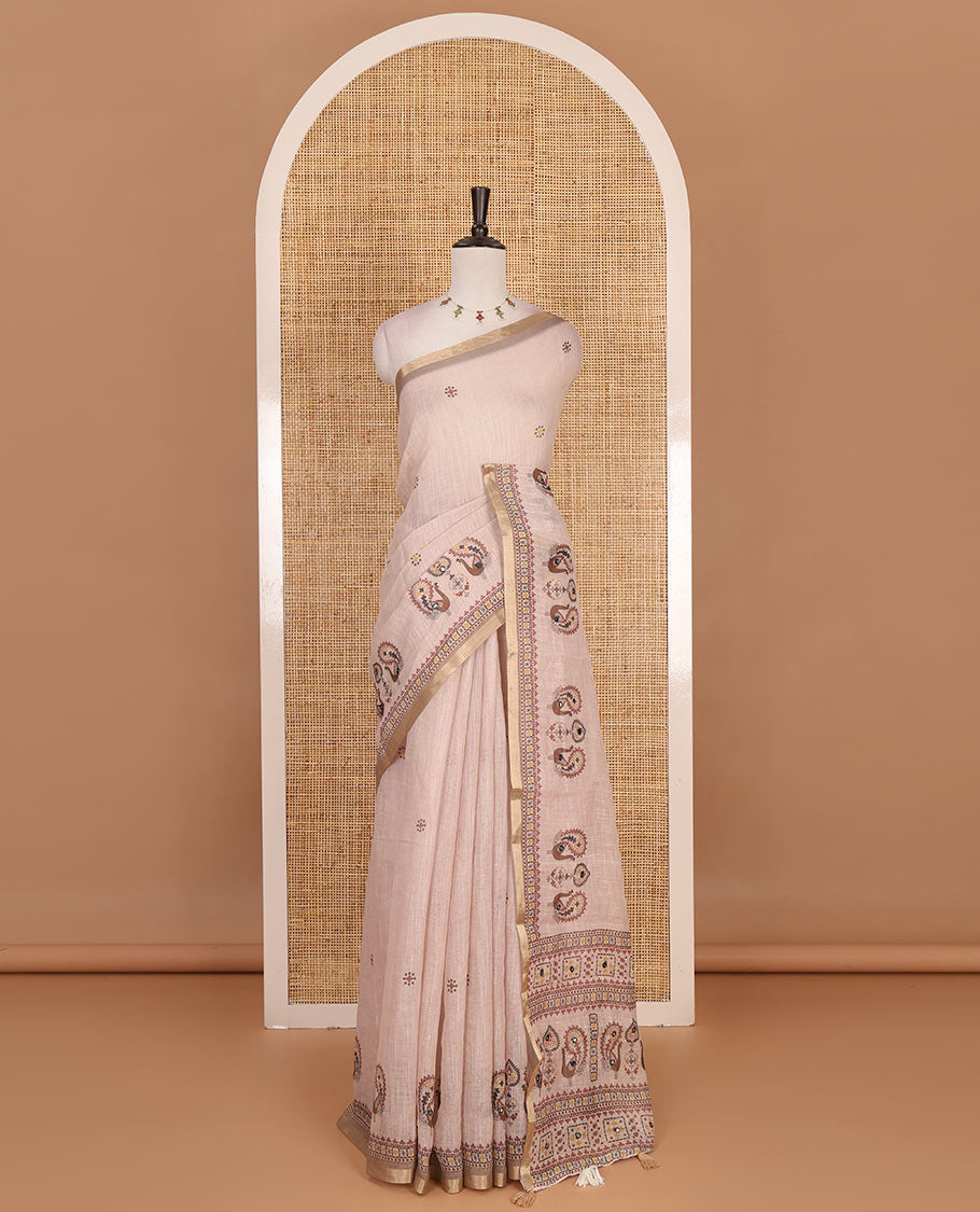 Chikku buttas with mirror work linen saree, zari border with peacock motifs print, printed mirror work pallu, and matching blouse