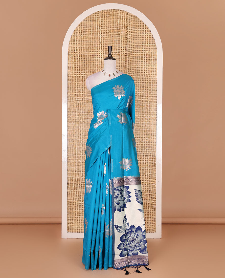 Borderless blue floral motifs steeped elite soft silk saree, contrast lotus-like motifs pallu, and contrast buttas blouse