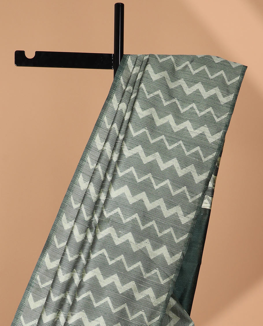 Borderless dark green kicha zig zad design semi jute saree with plain pallu & lining blouse