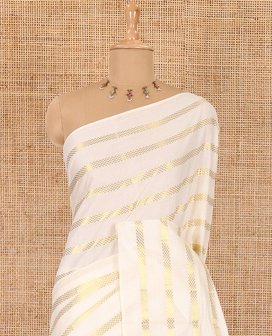 Borderless cream and green horizontal muthu zari striped Kerala cotton saree, self-pallu with tassels, and a matching blouse