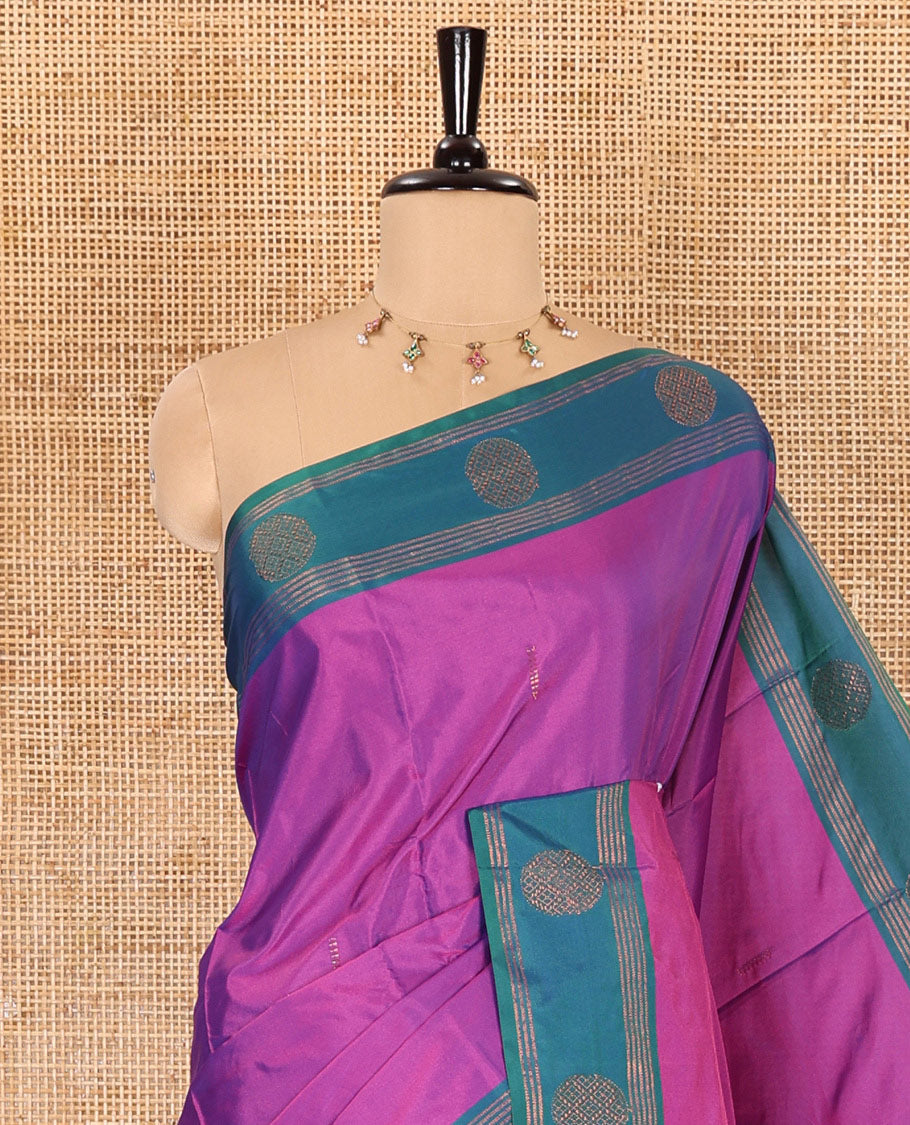 Magenta buttas semi-soft silk saree, contrast zari striped and round buttas border, striped pallu, and a matching blouse