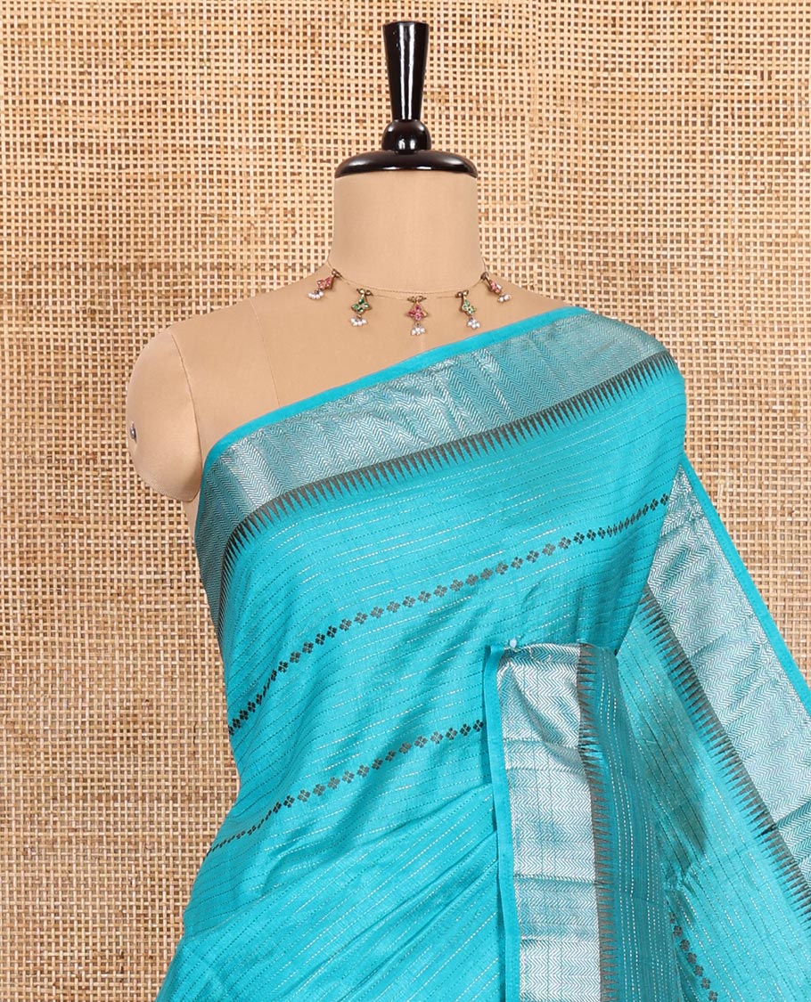 Blue Semi-Tussar Saree Decked Up with Zari Horizontal Stripes and Thread Floral Designs, Featuring a Subtly Woven Temple Zari Border, a Striped Pallu, and a Matching Blouse