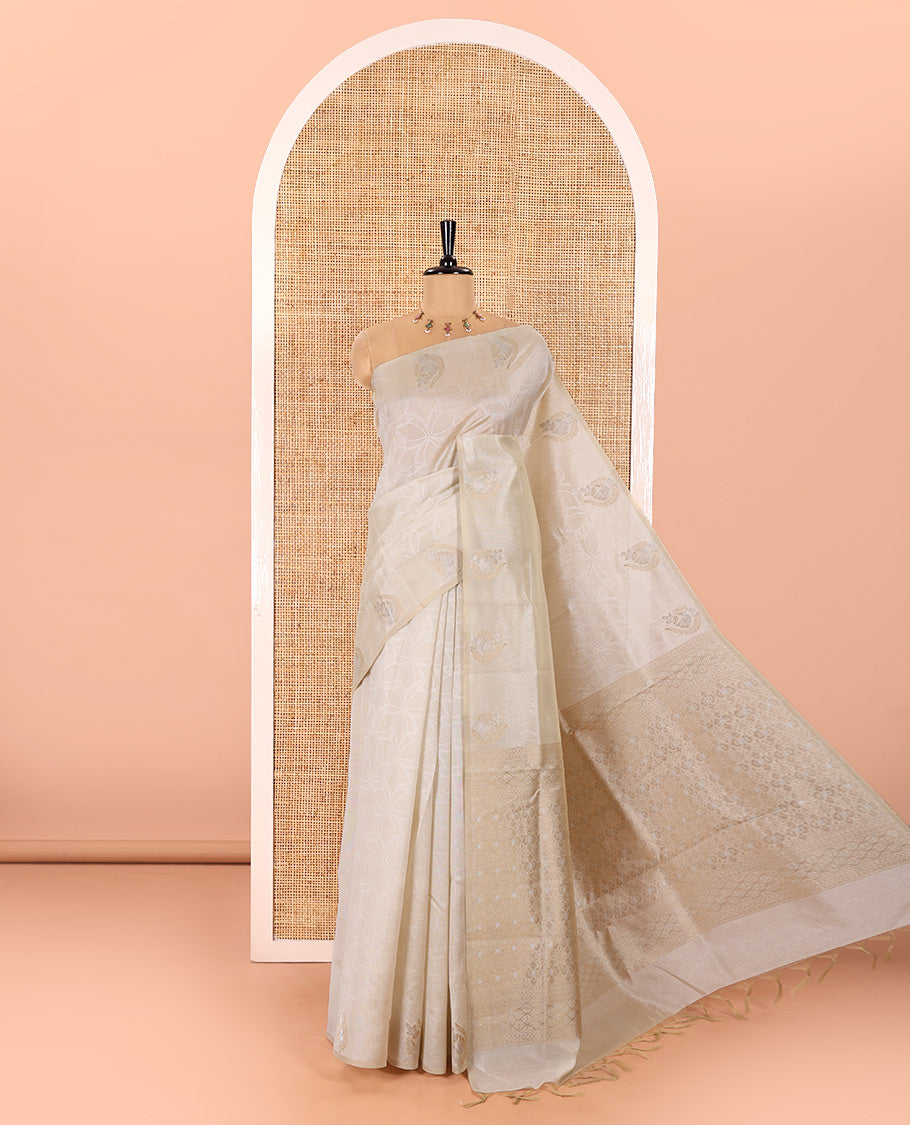 Cream Semi Tussar Saree Detailed with Jaal Design, Subtle Border of Zari Motifs, Delicately Woven Pallu of Intricate Designs, and Paired with a Matching Blouse