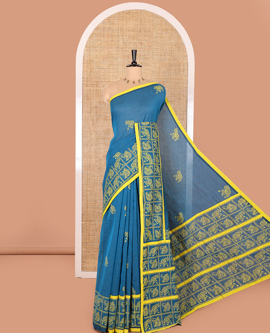Blue Mangalagiri Cotton Saree Adorned with Elephant Motifs Block Print All Over Its Body, Subtly Printed Border of Animal Butta Enclosed Checks, Pallu Mirrors the Same Border Print, and Paired with a Contrast Printed Blouse