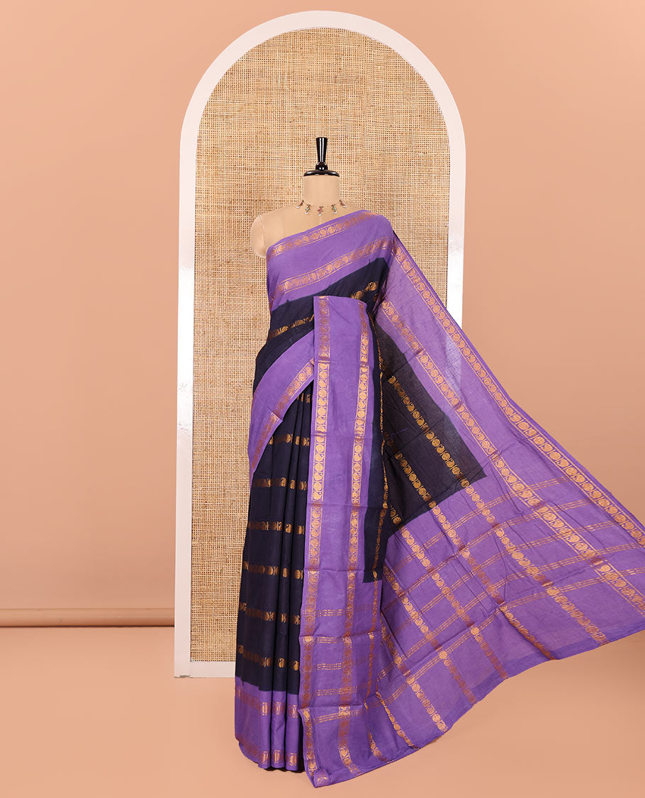 Blue Sungudi Cotton Saree, Adorned with Rudraksham and Paisley Buttas on Its Body, Complemented by a Contrast Rettai Pettu Border of Rudraksham and Paisley Designs, Gleaming Zari-Striped Pallu, and Paired with a Contrast Blouse
