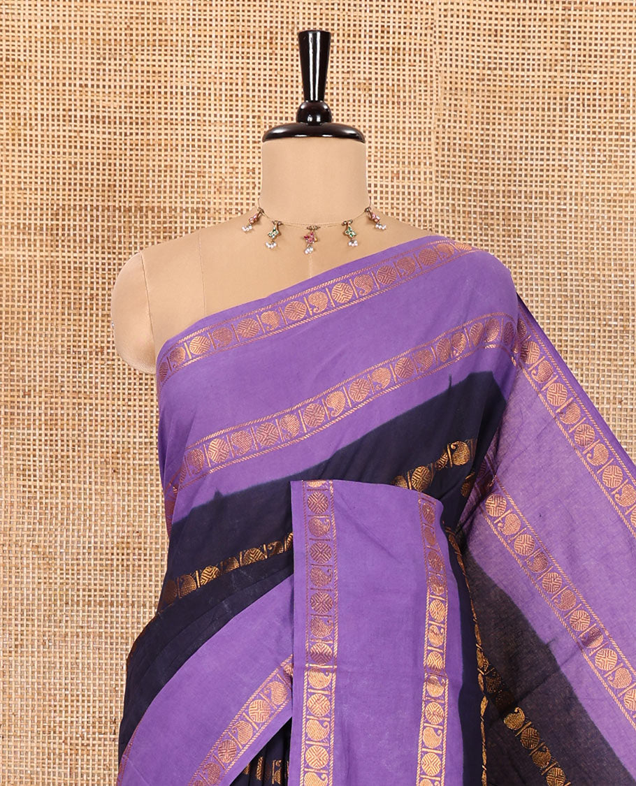 Blue Sungudi Cotton Saree, Adorned with Rudraksham and Paisley Buttas on Its Body, Complemented by a Contrast Rettai Pettu Border of Rudraksham and Paisley Designs, Gleaming Zari-Striped Pallu, and Paired with a Contrast Blouse