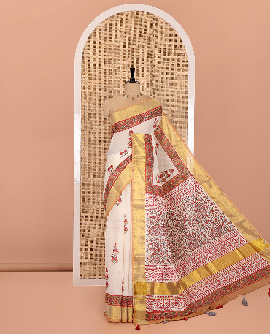 Cream Kerala Cotton Saree, Elevated with Floral Buttas Printed on Its Body, Highlighted by Gleaming Golden Zari Border, Pallu Features the Floral-Paisley Print, and Paired with a Matching Printed Blouse