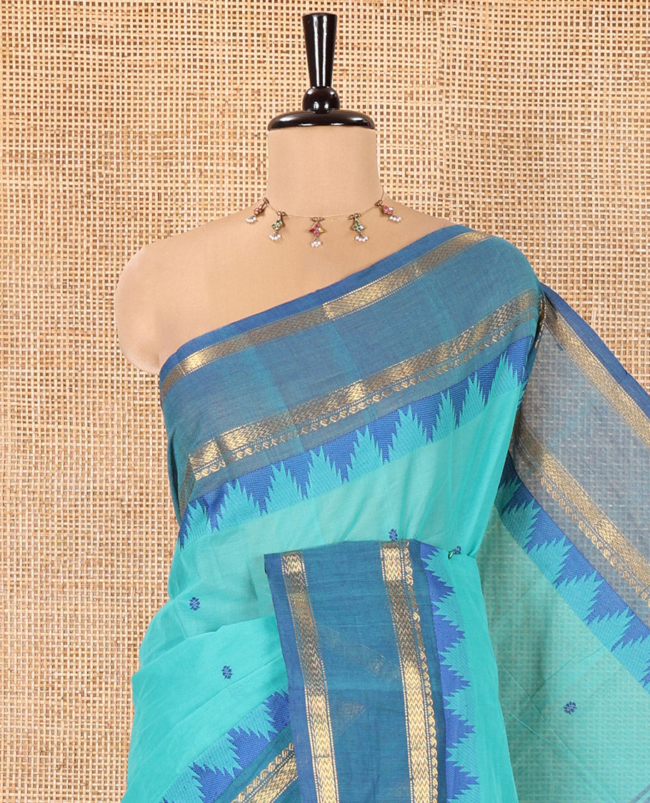 Rama Chettinad Cotton Saree, Subtly Sparkled with Thread Buttas All Over Its Body, Complemented by a Contrast Border Rettai Pettu Border of Paisley and Chevron Stripes, Subtly Designed Pallu, and Paired with a Matching Blouse