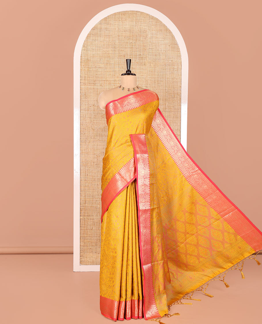 Mustard Elite Soft Silk Saree, Subtly Sparkled with Floral-Paisley Designs On Its Body, Complemented by Contrast Traditional Zari Designs Woven Border, Intricately Designed Pallu, and Paired with a Matching Blouse