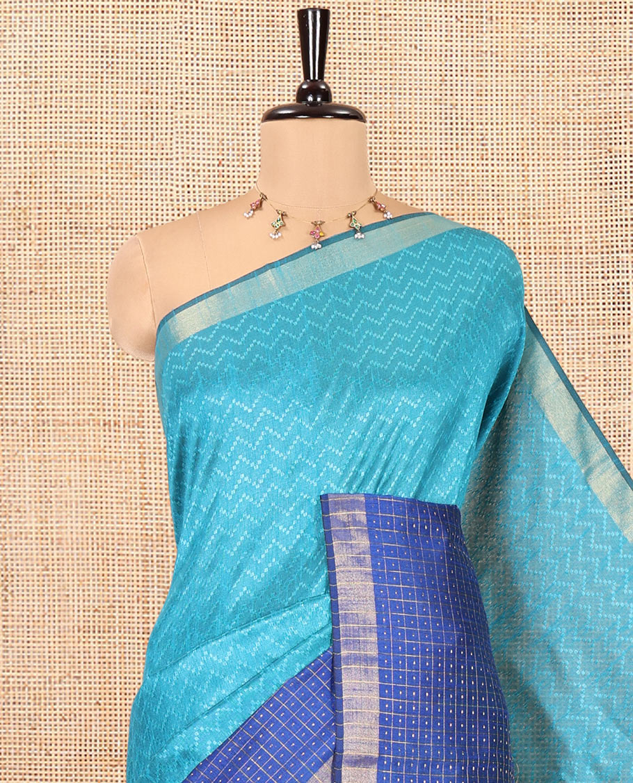 Rama Blue Semi-Raw Silk Saree, Delicately Woven with Zig-Zag Stripes All Over Its Body, Complemented by Contrast Border of Butta Enclosed Checks, Striped Pallu, and Paired with a Contrast Blouse