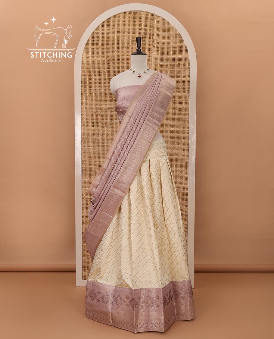 Cream semi-banaras material chudidar,leheriya zari skirt,contrast lavender zari & swarovski stonework border,jacquard blouse & zari weave dhavani