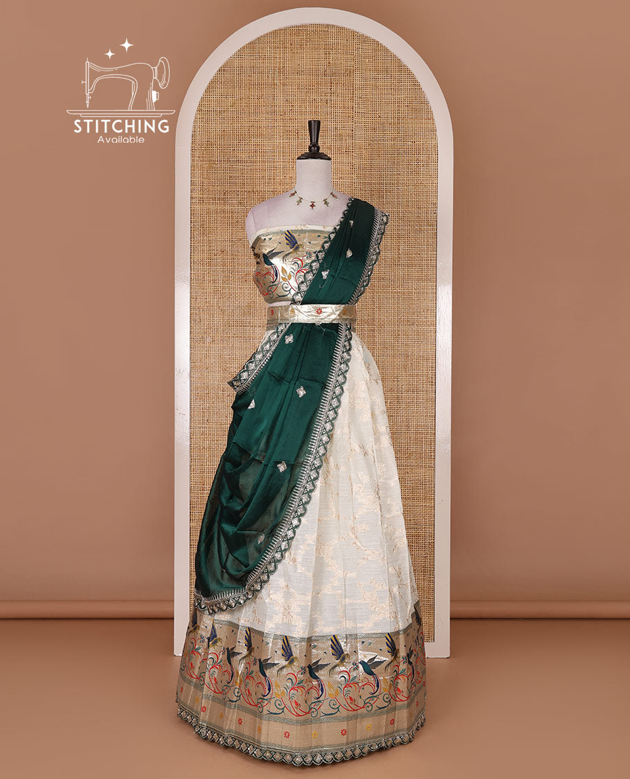 Cream banaras halfsaree, jaal jacquard skirt, contrast peacock green paithani border, matching blouse, and Syska georgette embroidered dhavani