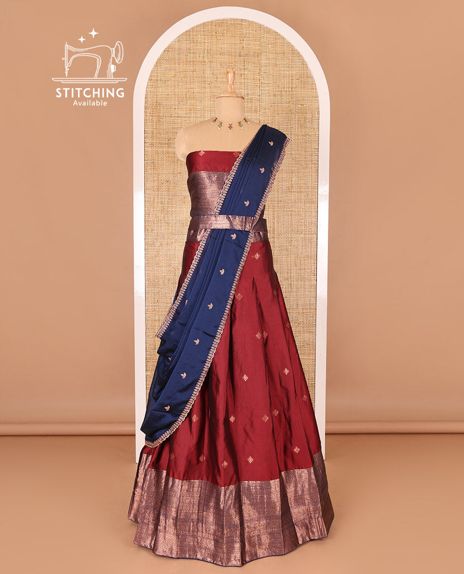 Maroon taffeta silk half-saree, zari buttas and contrast traditional zari bordered skirt, a matching taffeta silk blouse, and contrast embroidered satin georgette dhavani