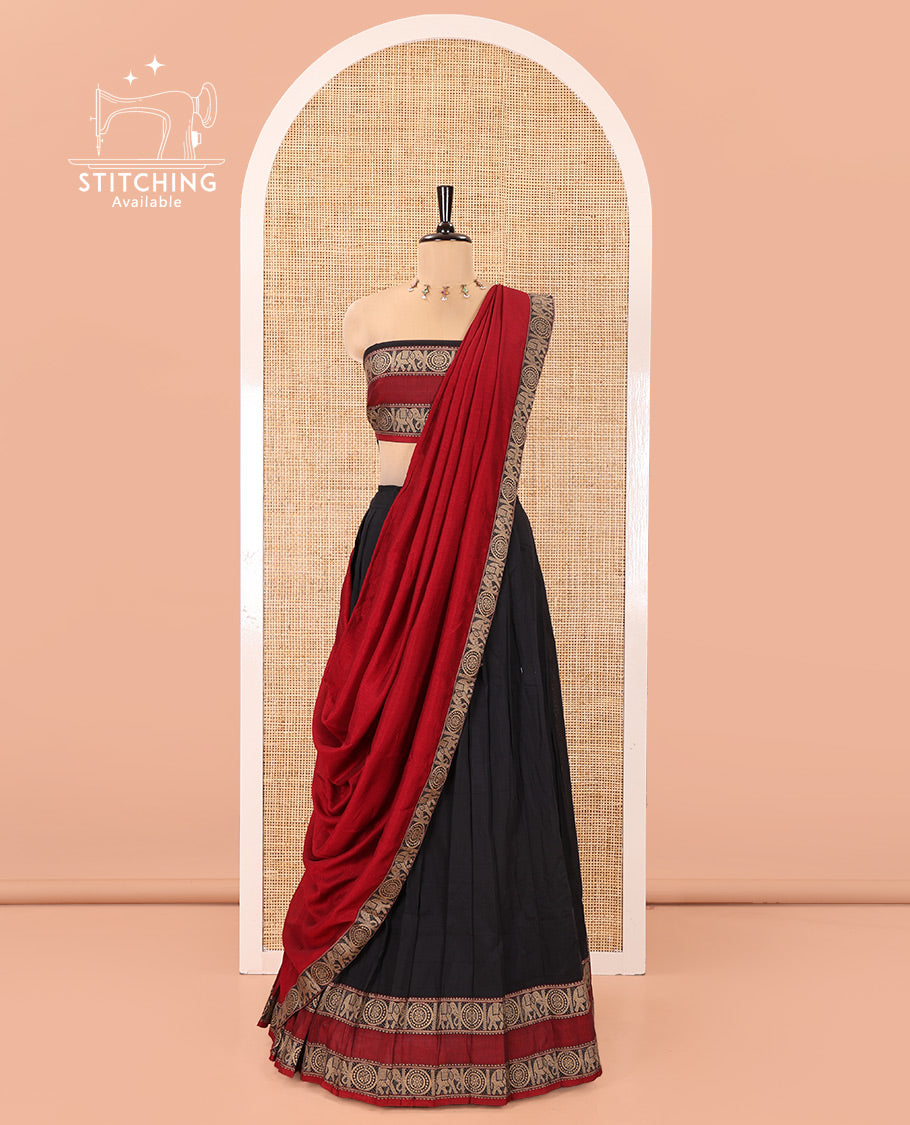 Black-Red Mercerised Cotton Half-Saree Features Plain with Contrast Rettai Pettu Elephant-Chakram Bordered Skirt, Paired with a Matching Blouse, and Comes with a Contrast Elephant-Chakram-Bordered Dhavani