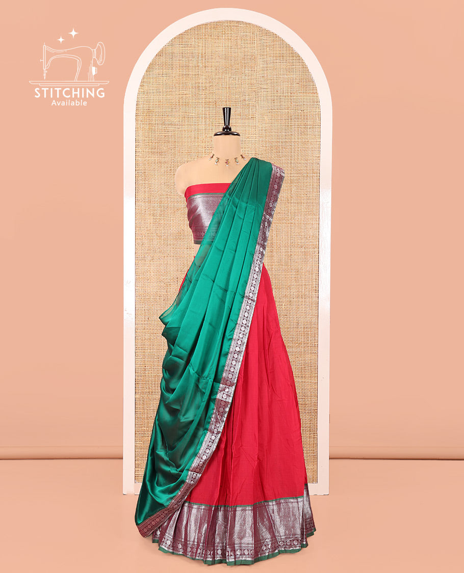 Tomato Red-Green Mercerised Cotton Half-Saree Features Plain with Contrast Traditional Zari Bordered Skirt, Paired with a Matching Blouse, and Comes with a Contrast Bordered Dhavani