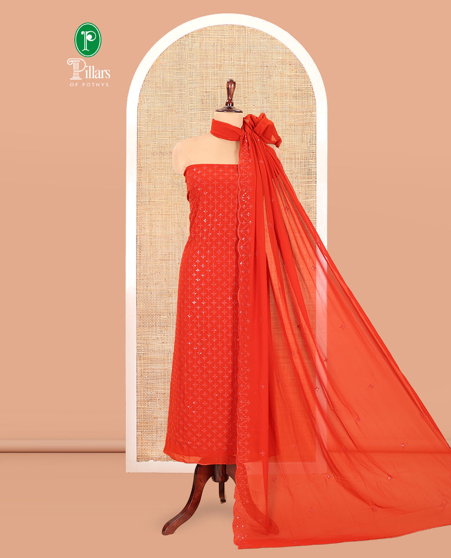 Rust Georgette Material Churidar, Woven with Sequins Embroidered Top, a Matching Bottom, and Embroidered Dupatta